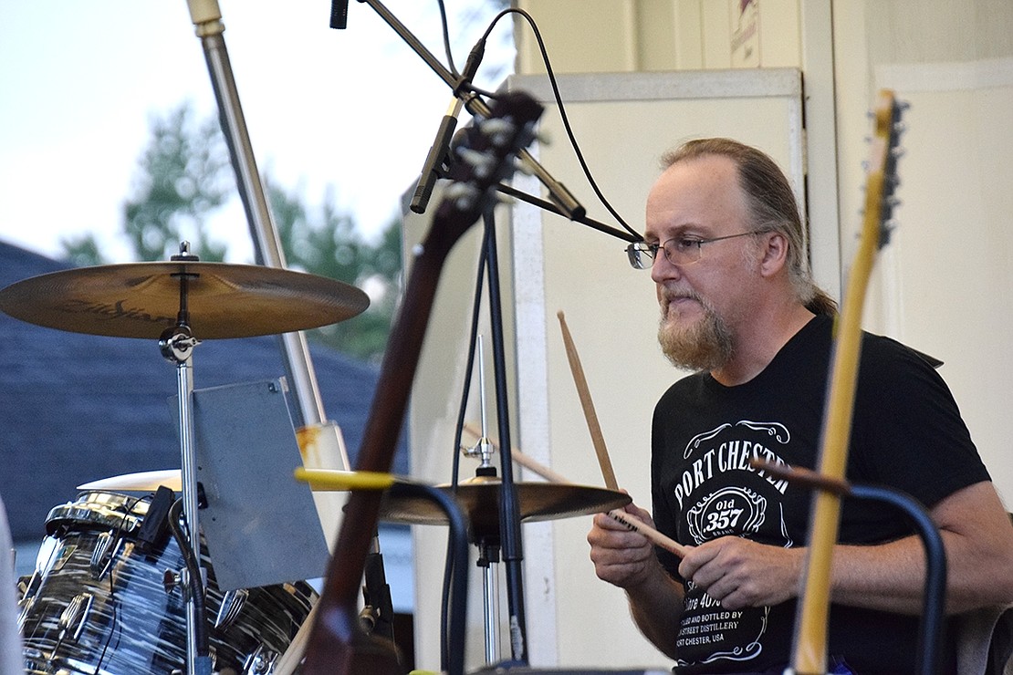 Drummer Kevin Dick supplies the rhythm for the band with his percussion.