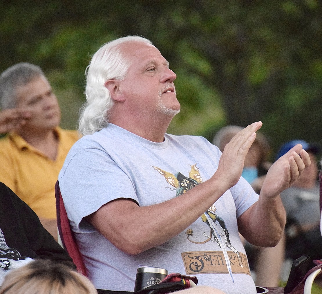 South Regent Street resident Clifford Russell claps along to the music at the Digging for Sharks concert in Lyon Park.