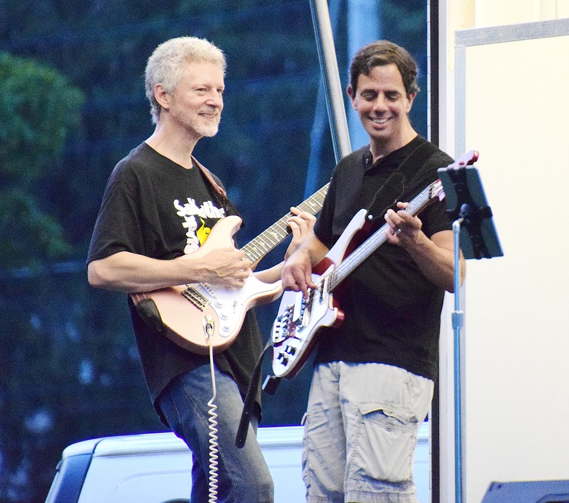 Guitar player Kevin Forsberg (left) and bass player Chris Inzero rock out during their band’s performance.