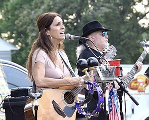 Andrea Ekizian (left) and her band rock out in Rye Brook.