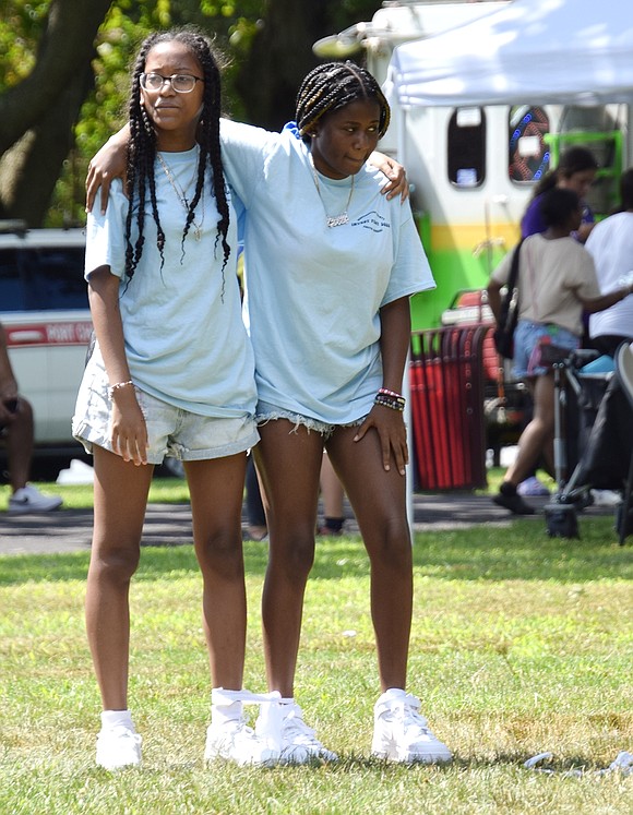 Faith (left) and Journey Adamson, a Port Chester High School rising freshman and junior respectively, get ready at the starting line for a three-legged race.