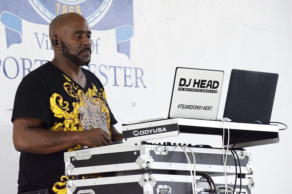 DJ Wreckless, also known as Corey Thomas from White Plains, supplies music for eventgoers.