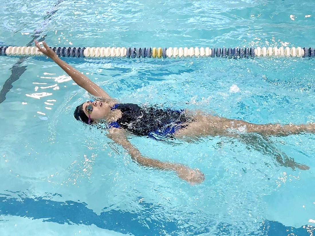 Madeline Saunders, a Port Chester High School Class of 2023 graduate, swims the backstroke in a swim meet. Saunders will attend Western Connecticut State University and will compete on its swim team in the Fall.