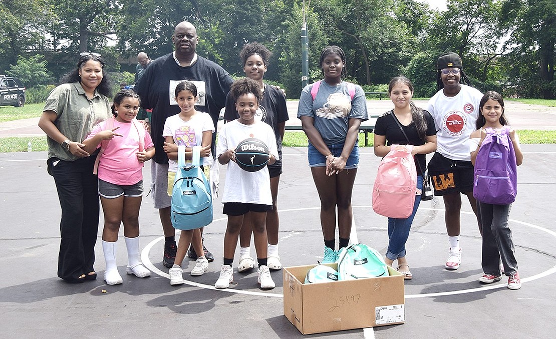 As a show of appreciation, The Give & Go Girls, a local basketball group that hosts clinics for young females, are presented with new equipment—basketballs, T-shirts and backpacks—during a break in the Unity Day basketball tournament. From left: Rockland County resident Chevonne Washington, Stamford, Conn.-based third-grader Anastasia Acosta, Unity Day co-founder Derek Vincent, Port Chester Middle School sixth-grader Hailey Umanzor, Tappan Zee High School 11th-grader and co-founder of The Give & Go Girls Amiyah Johnson, Port Chester Middle School sixth-grader Morgan Martin, Port Chester High School freshman Adriana Aguilar, Norwalk, Conn. resident coach DJ Peoples and Park Avenue Elementary School fifth-grader Helen Boctor.