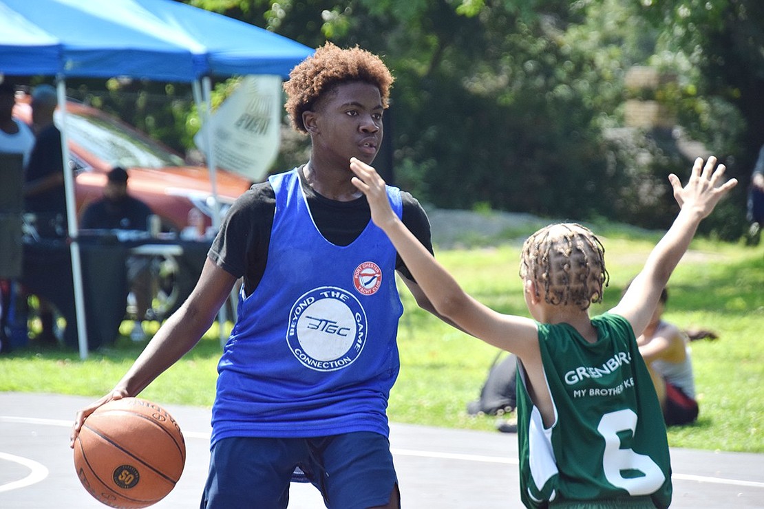 Incoming Port Chester High School freshman Christopher Martin is unphased by his opponent attempting to block him.