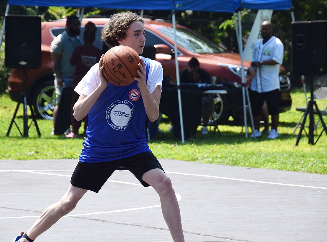 Tommy Hinz, a rising freshman at Port Chester High School, prepares to pass the basketball to a teammate.