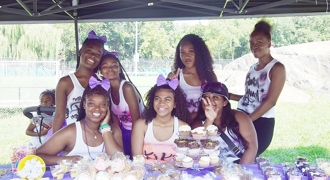 Members of Royal-T Creationz Dance Team and their Port Chester-based coaches sell baked goods to raise money for cheer camp. From left, back: Port Chester Middle School eighth-grader Ray Watkins, Port Chester High School junior Destini Furman, and coaches Nana Jones and Yanna Watkins. From left, front: Port Chester High School sophomore Jahnysse Stanley, Greenwich High School sophomore Kaylee Carty and coach Daishanea Bruce.