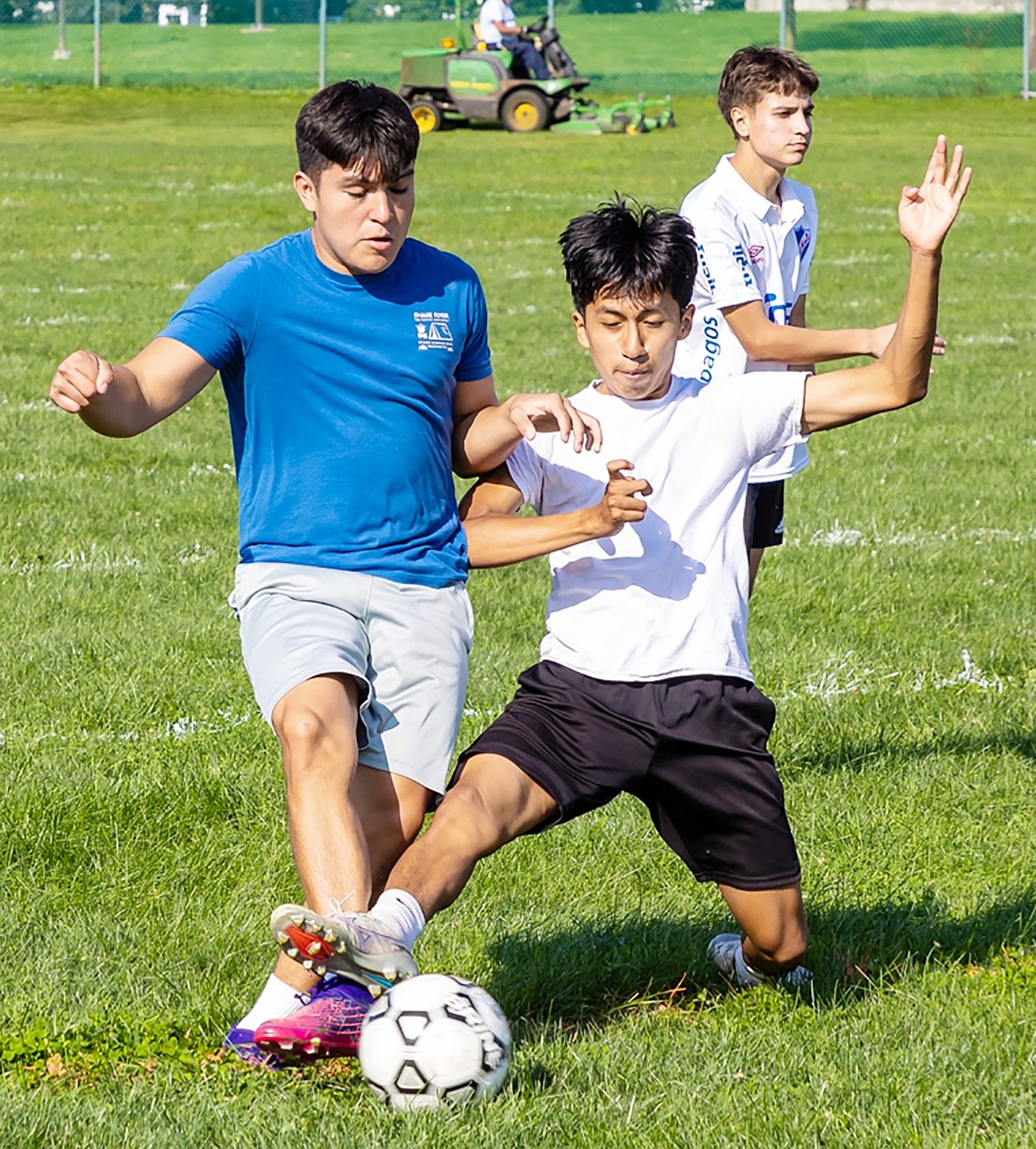 Alex Sigua tries to steal the ball from Zahid Cardenas during a scrimmage on the Port Chester High School field on the second day of practice and tryouts for the boys’ varsity soccer season on Tuesday, Aug. 22.