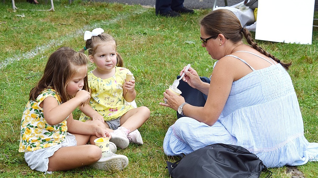 The Fergusons of Glenville keep cool with ice cream from the Longford’s food truck, one of a handful of trucks providing provisions for hungry festival-goers. They are Charlotte, 6, Reese, 3, and Lauren.