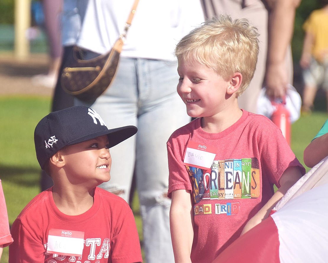 Future best friends? Maybe! Incoming Ridge Street Elementary School kindergartners Ace Lambino (left) and David Golodnikov giggle together during a parachute bonding activity at Pine Ridge Park on Tuesday, Aug. 29. As two of Blind Brook Schools newest students, the children are attending a PTA-hosted Kindergarten Social to help get ready for the first day of school on Tuesday Sept. 5.