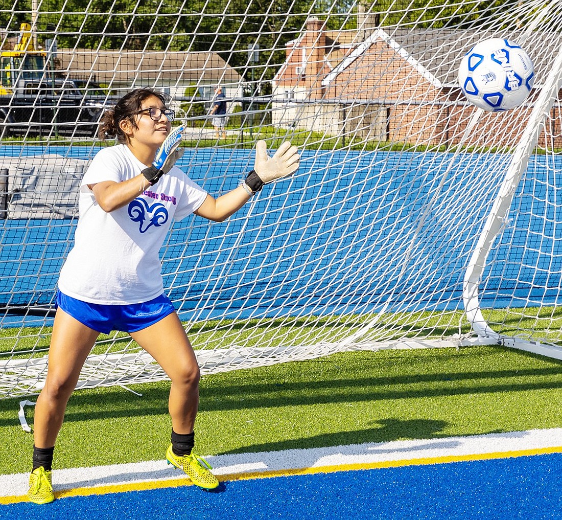 Senior Yarely Cruz keeps the ball out of the goal during a Lady Rams soccer practice at Port Chester High School last week.