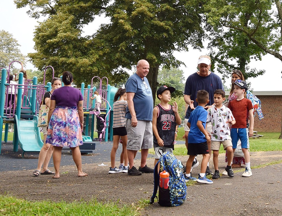 King Street Elementary School families catch up while their children take the time to play.