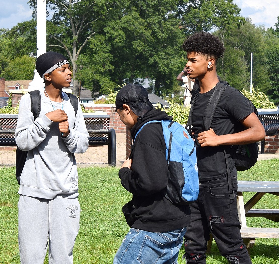 Sophomore Jahmeer Furman (left) catches up with senior Tyamire King and junior Jayden Arbusto in the flag plaza.