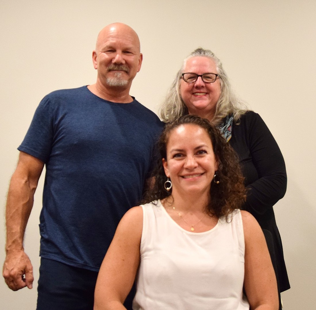 Three of the founders of the new Port Chester Hispanic Advisory Board, Rick Hyland (left), Juliana Alzate, and Linda Turturino, pose for a photo in the Westmore News conference room on Monday, Sept. 11, after discussing their motivations to establish the group.