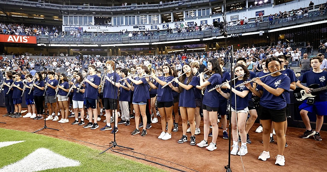 Members of the Blind Brook High School Band play the national anthem at Yankees Stadium on Thursday, Sept. 7.