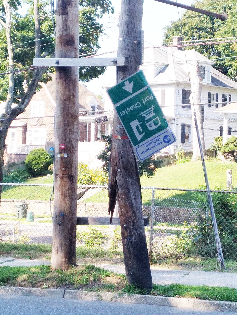 Inverted sign on utility pole across from 325 King St.