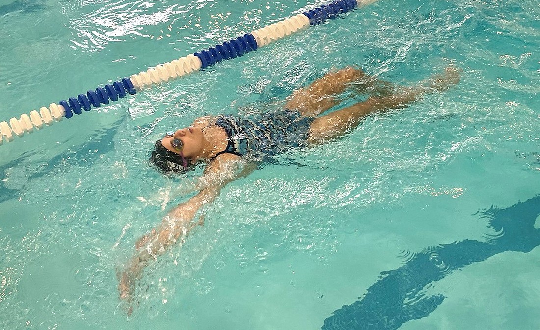 Senior Melody Sapione swims the very strong backstroke leg of the 200-yard Individual Medley, the Port Chester team's most difficult event in their meet against Pearl River/Albertus Magnus.
