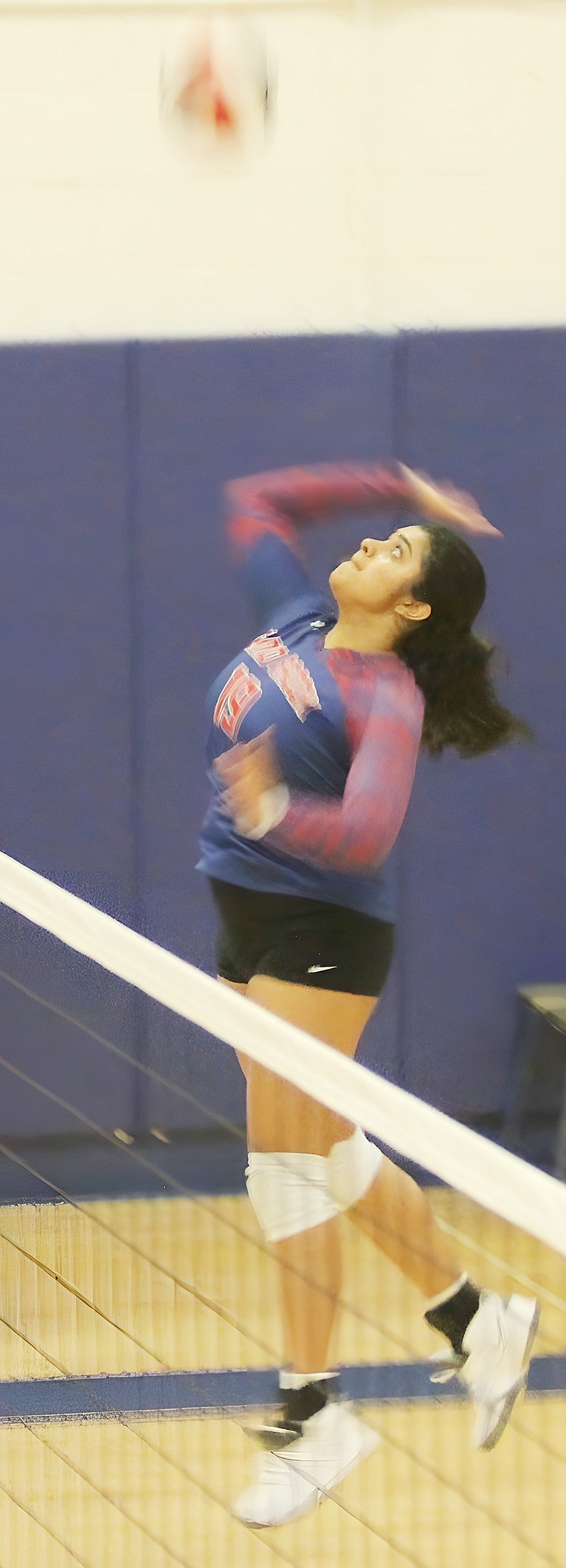 At the net, Tanisha Venkatapur jumps high, spiking the ball and earning Blind Brook a point against Valhalla at home on Tuesday, Sept. 19. The Lady Trojans lost a close 3-2 game to the Vikings.