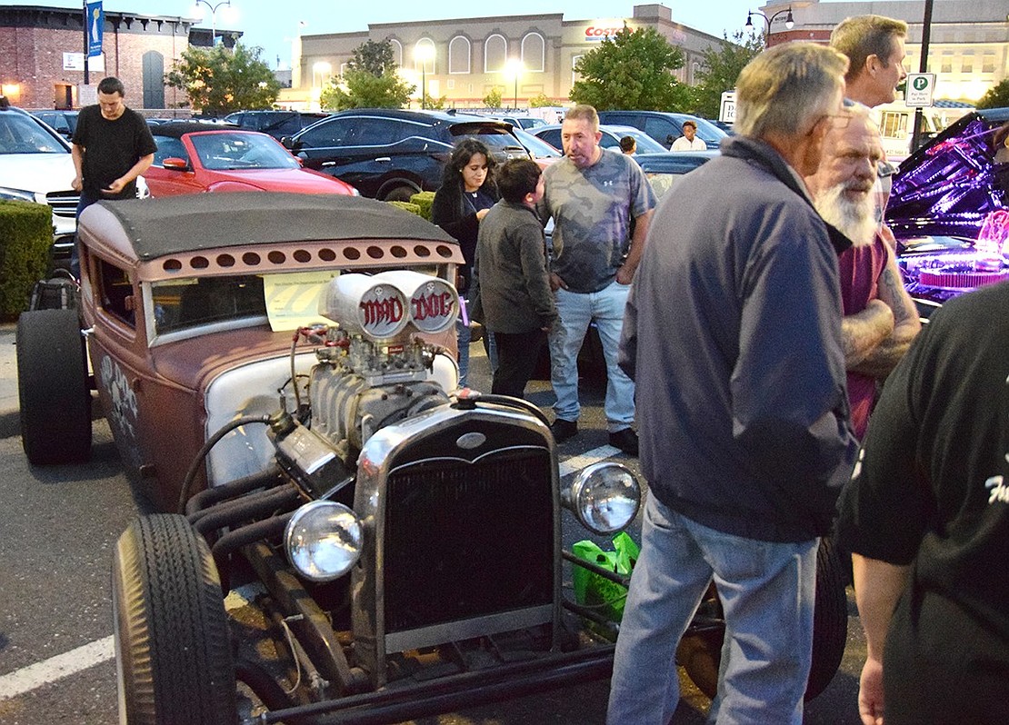 Mad Dog Service, an auto repair shop on South Main Street, drew a crowd with its 1931 Blown Deuce, owned by Joe and Jon Lovallo.