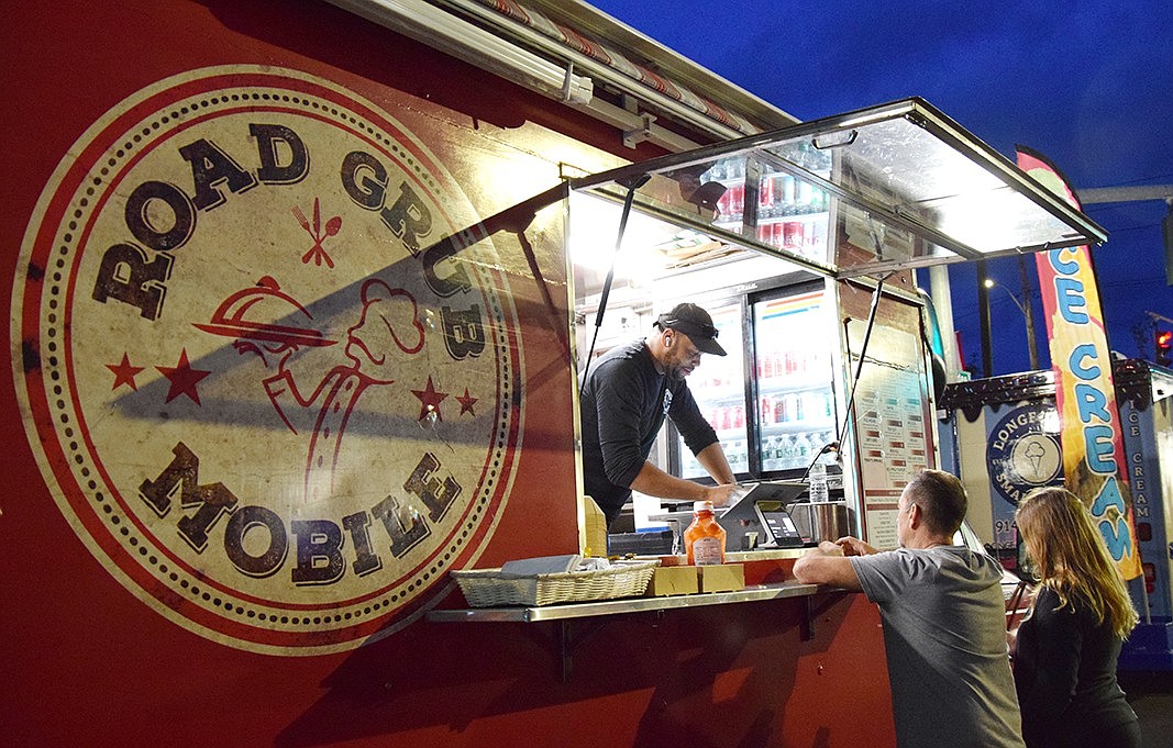 Throughout the night, families were lining up at the small variety of food trucks, such as Road Grub Mobile, to grab a bite to eat.