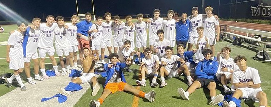 The Blind Brook Trojans pose after their nighttime 3-2 victory at Valhalla on Tuesday, Sept. 19.