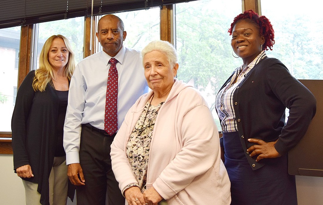 Members of the Port Chester Housing Authority team are senior accounting clerk Sandra Capolino (left), new Executive Director Michael Morris, tenant relations assistant Syreeta Sinclair and clerk Janice Mollica.