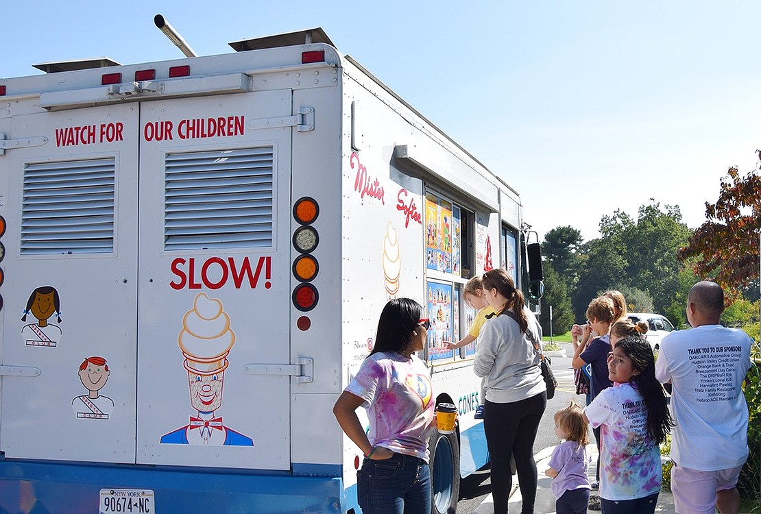 Families beat the heat by grabbing ice cream treats from the Mister Softee truck that was stationed at Crawford Park.