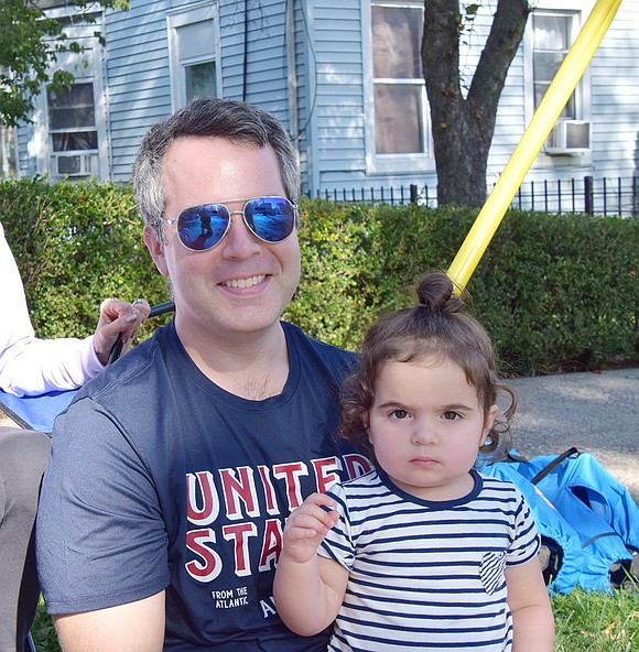 Thornwood residents Mike Nangle and his 2-year-old daughter Madelyn catch the parade with their Port Chester-based loved ones.