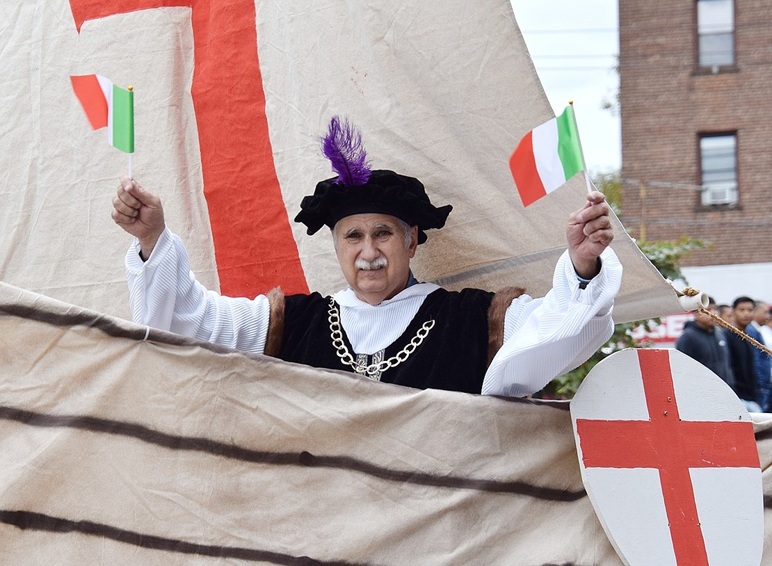 Portraying Christopher Columbus in the parade’s grand finale, Port Chester resident Nate Casterella waves to the crowds while riding a float replicating one of the explorer’s ships.