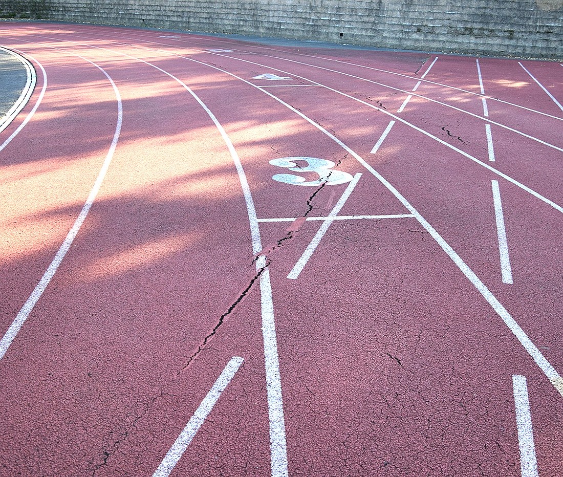 The track that surrounds the Blind Brook High School football field is lined with cracks on Oct. 11. A group of parents has created a new nonprofit that aims to upgrade both the track and the field.