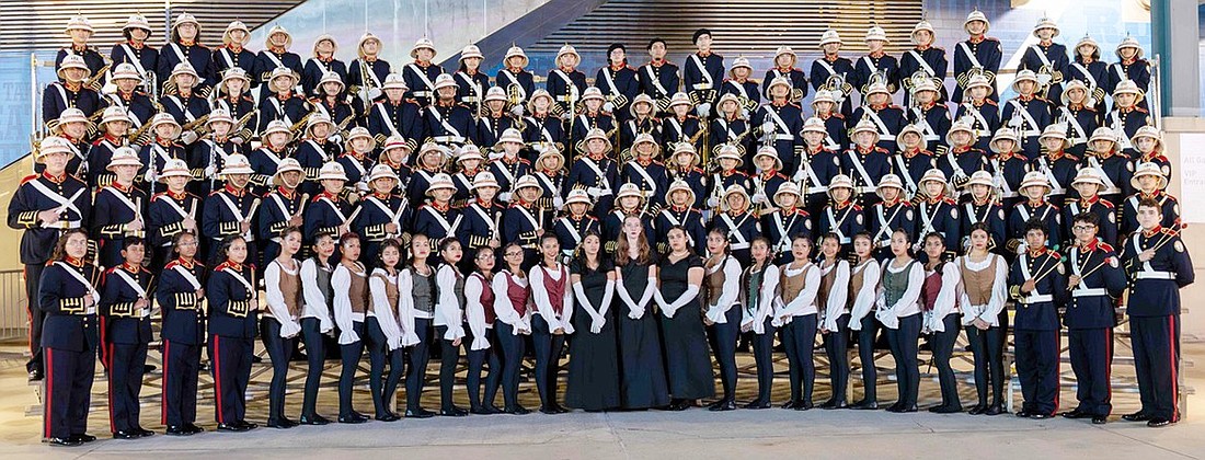 The Port Chester High School Marching Band lines up for a formal photo.