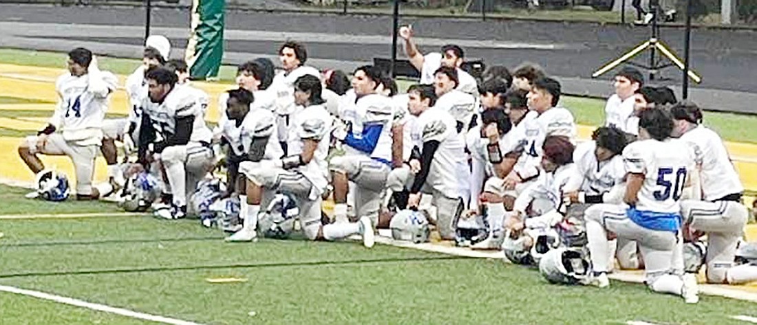 The Port Chester Rams football team huddles after a close 26-24 victory at Ramapo on Saturday, Oct. 7.