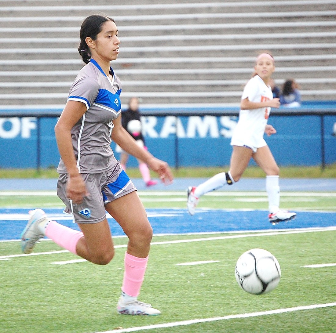 Daniela Lopez maintains possession as she attempts to lead the Lady Rams soccer team to victory over White Plains on Tuesday, Oct. 10 at home.