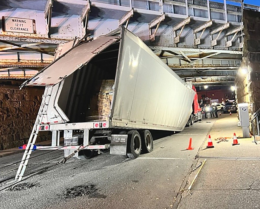 A truck loaded with motor oil struck the MTA bridge over King Street early in the morning on Thursday, Oct. 12. This photo was taken at 6:30 a.m. The cleanup effort took most of the day to complete.