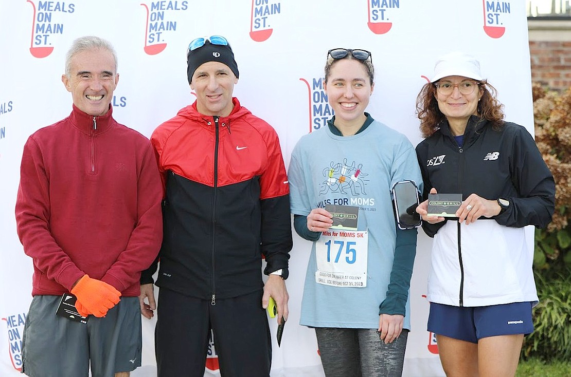 Male and female 5K race winners, from left, Conor O’Driscoll of White Plains (2nd place), Jonathan Frieder of Rye Brook (1st place), Madeline Bord of NYC (1st place), and Christine Vincent of Fairfield, Conn. (2nd place).