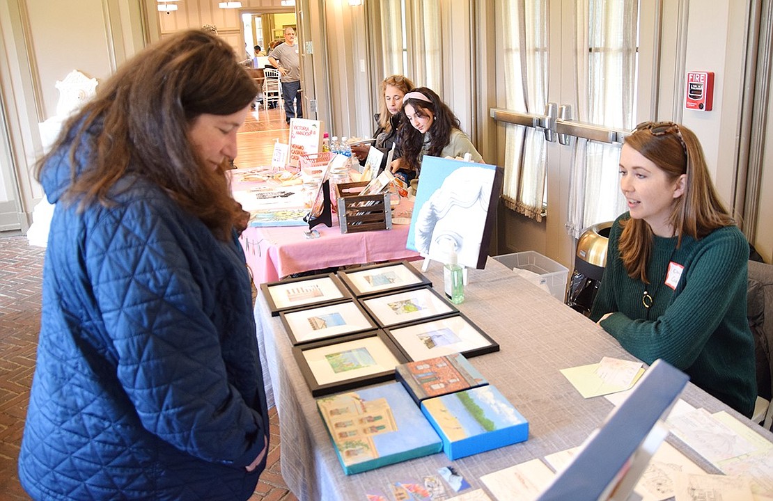 Rye Brook resident Caryn Greenspan (left) chats with Emily Cook of Port Chester, one of the new artists featured at the ART10573 exhibit.