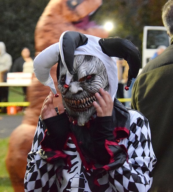 A terrifying jester makes an appearance at the park, and under the mask is Port Chester Middle School student Julian Salvatierra.