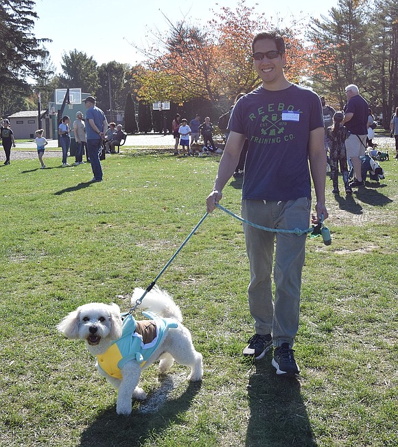 Cody the dog prepares for battle as Squirtle, a Pokémon, with his owner Danny Fung, a Tamarack Road resident who also serves as a Blind Brook Board of Education member.