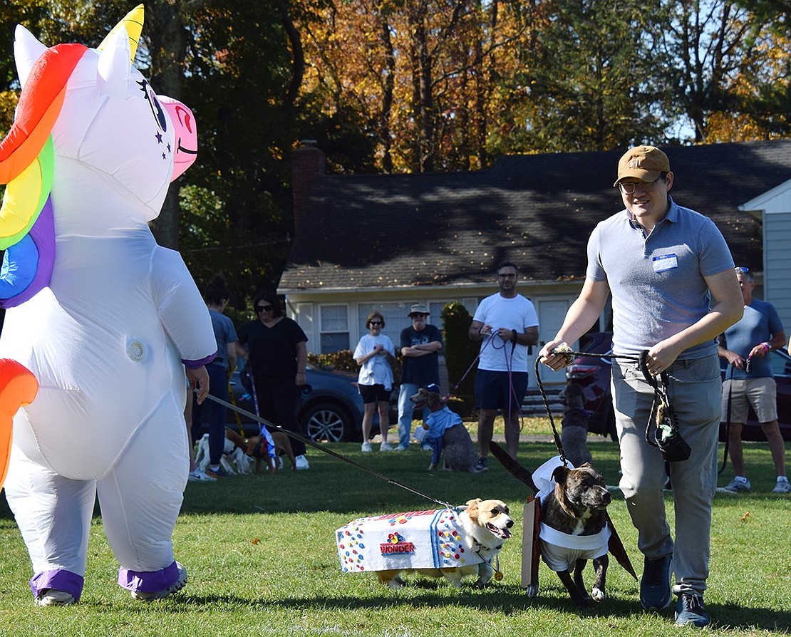 The Shue family of Rye Brook with two dogs who received honorable mentions, Boba (left) and Chuck. The dogs looked as sweet as ever as a loaf of Wonder Bread and a s’more, respectively.