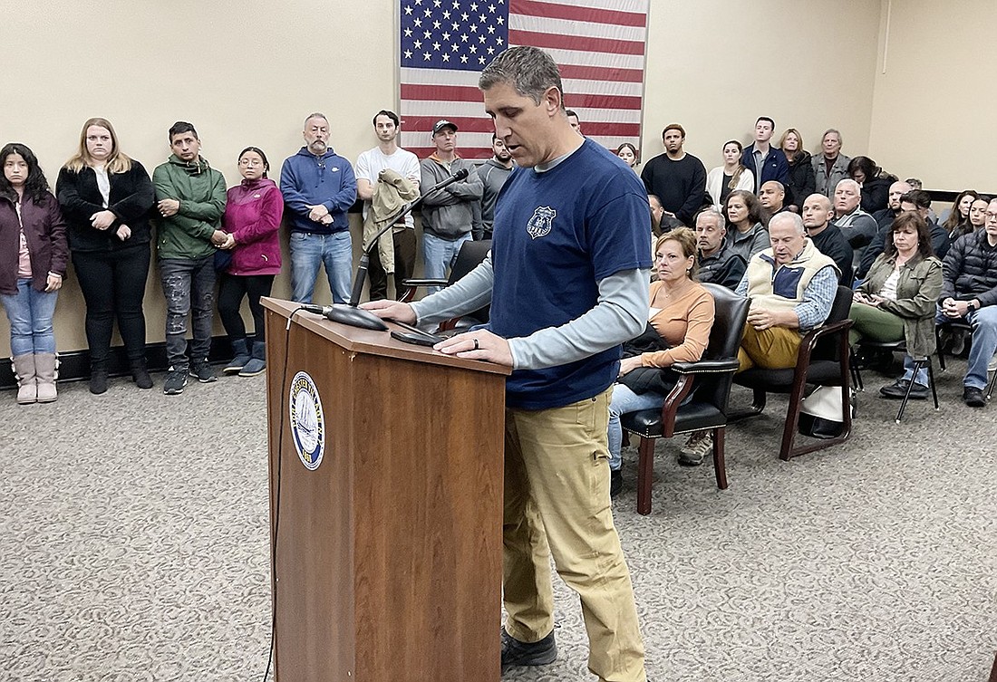 With a packed room of supporters behind him, Port Chester Police Association President Mike Giandurco addresses the Board of Trustees on behalf of probationary Police Officer Matthew Barbara Monday night, Nov. 6 in the Town of Rye courtroom at 350 N. Main St.