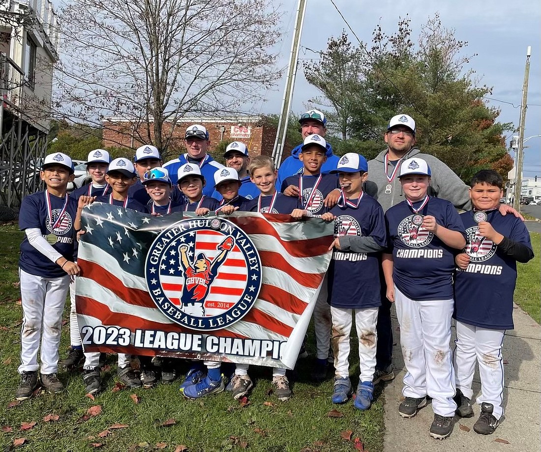 The Port Chester Youth Baseball League 11U Pirates pose with their banner after being named 2023 Greater Hudson Valley Baseball League Champions in their age group for the fall season following their victory over the Frozen Ropes Rockies of Chester, N.Y., last Saturday (11/4) in Danbury, Conn.