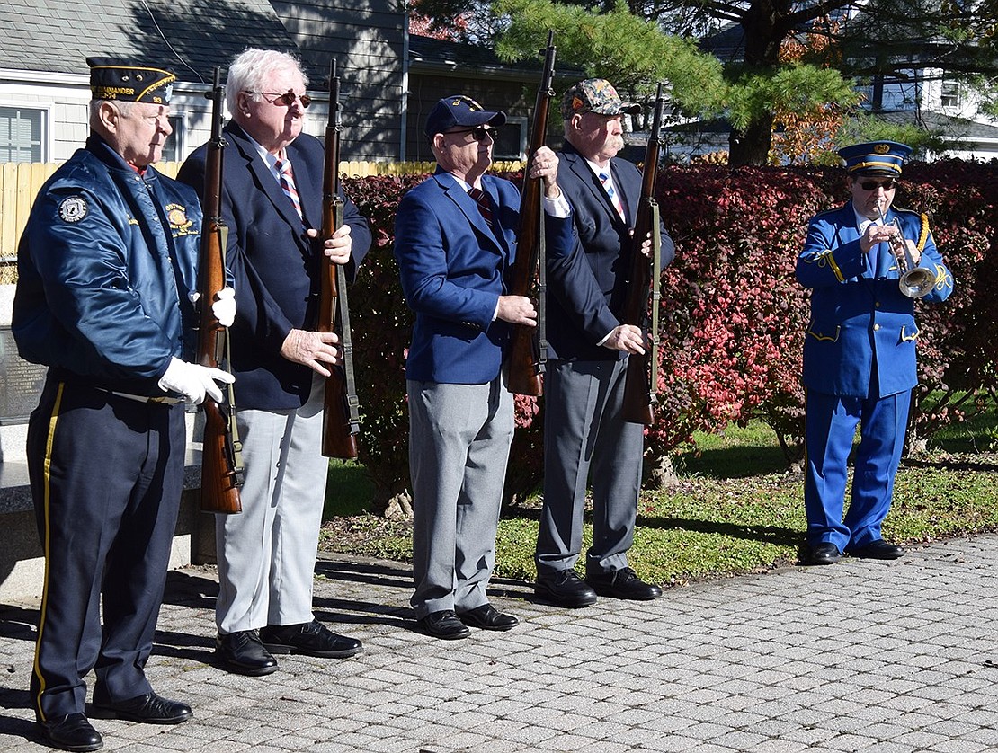 After the firing team made up of veterans, from left, Ken Neilsen (Vietnam era Navy), Tom Gallagher (Vietnam era Army), Herb Bocchino (Navy) and William P. Sullivan Jr. (Marine Corps Vietnam) fired shots to honor all veterans, bugler Anthony Bubbico, Jr. of the Port Chester American Legion Band plays Taps in memory of veterans who have died.