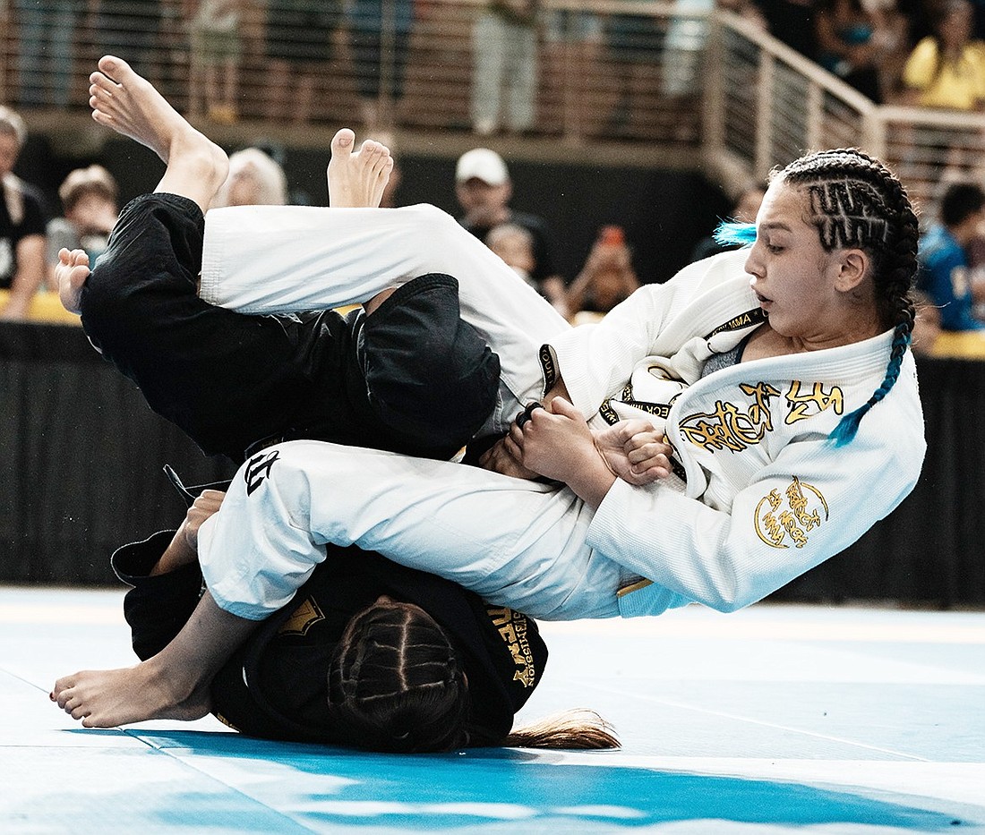 Wrestling and judo prodigy Laila Builes (on top) shows the form and concentration that make her a threat as both a Ram and Lady Ram wrestler and state title contender now that she has received the OK to compete for the Port Chester varsity in both categories.