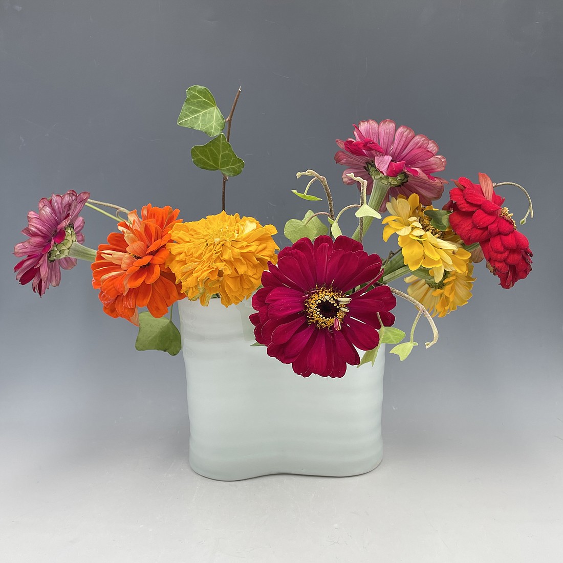 Wave Vase with Flowers by Dalia Berman is one of the artworks for sale at the Clay Art Center Holiday Market which runs thru Dec. 23. See 10573 Calendar of Events for details.