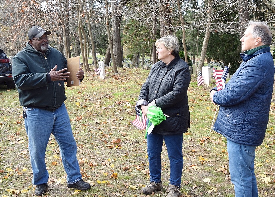 David Thomas, founder and president of the Friends of the African American Cemetery, discusses the importance of honoring the veterans buried in the plot of land at the rear of Greenwood Union Cemetery in Rye on Saturday, Nov. 18.