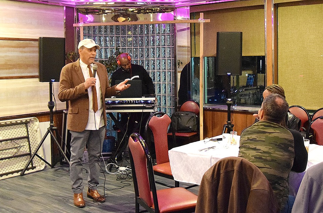 Charles Morgan, executive director of the Port Chester Youth Bureau, speaks on the importance of giving back to the community at the Thanksgiving dinner held by the group at the Port Chester Coach Diner on Monday, Nov. 20.