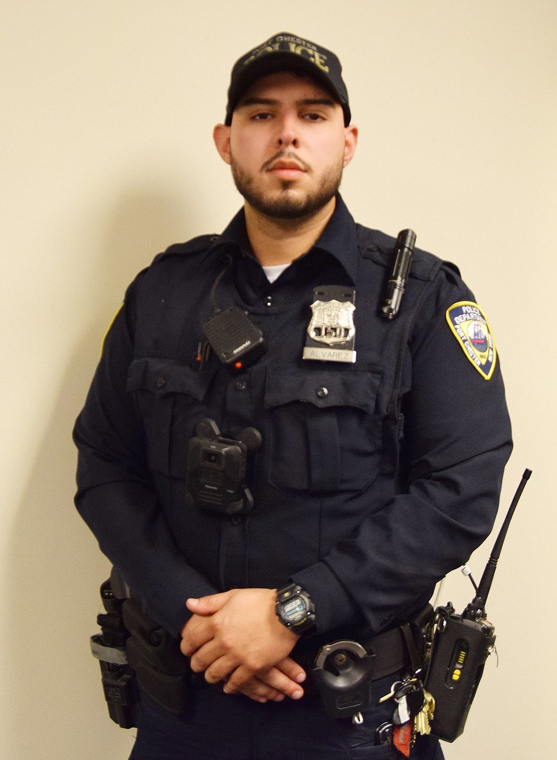 Lifelong Port Chester resident Stephen Alvarez poses for the camera inside the Port Chester police station on Tuesday, Nov. 21. Instated on Aug. 4, Alvarez said it marked the completion of a long journey.