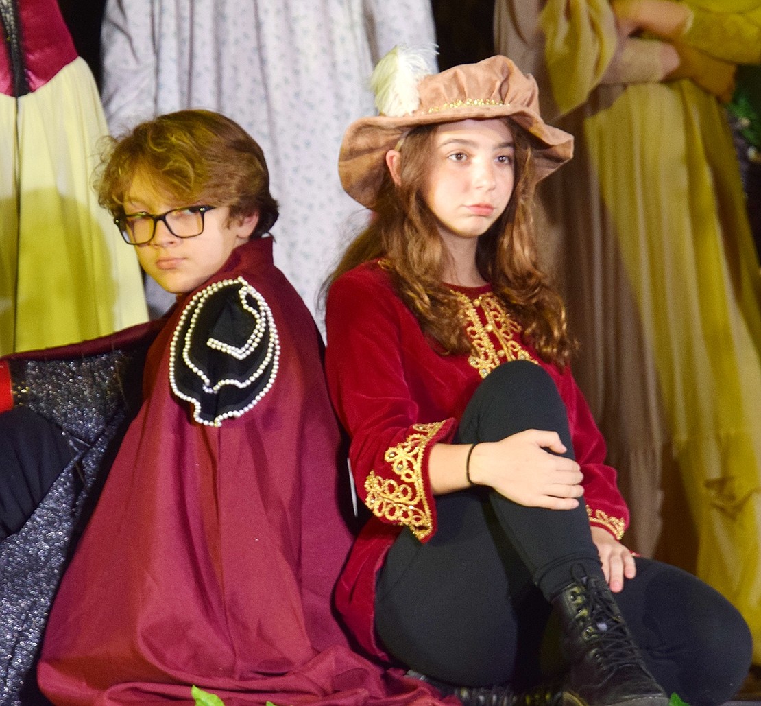 Guilherme Policarpo (left) and Madison McConnell strike a pose during the musical’s final number, “Everafter.”