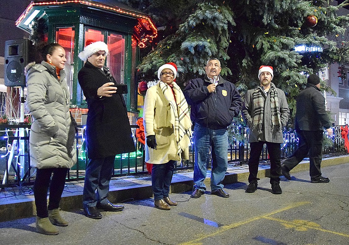 Preparing for the lighting of the large blue spruce, Port Chester trustees stand together to thank all community members and Village employees who made the celebration possible. From the left: Juliana Alzate, John Allen, Joan Grangenois-Thomas, Mayor Luis Marino and Phil Dorazio.