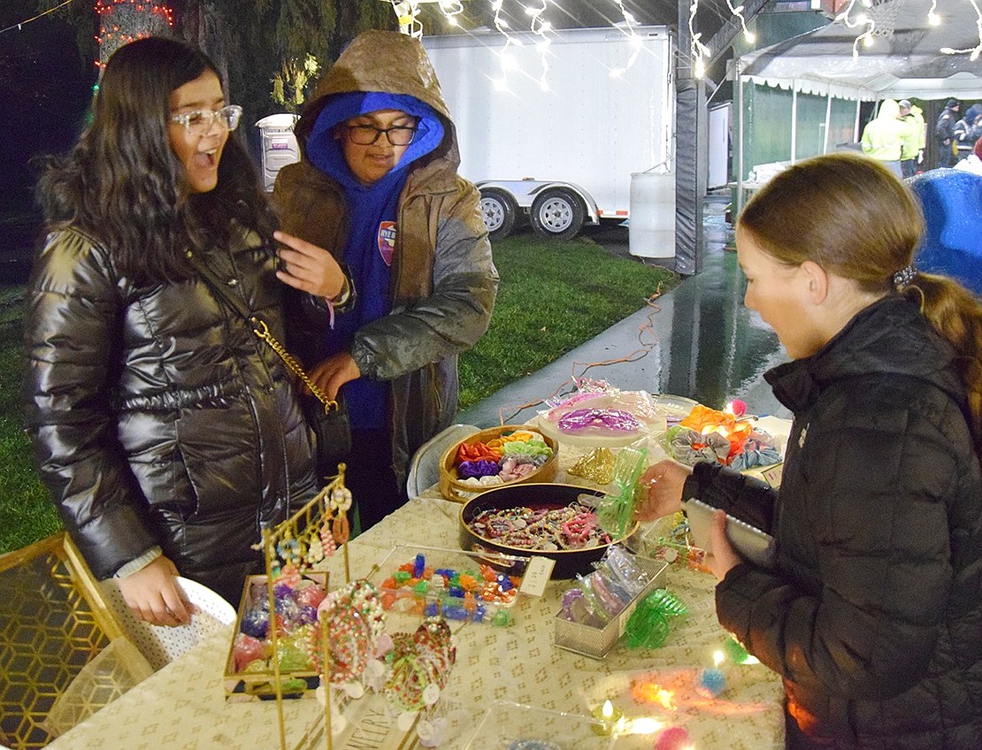 Anvitha Bhatt (left), 11, and her younger brother, Arnav, sell accessories and jewelry, some pieces handmade, to Caity Davis, 11. All the Ridge Street School students are Rye Brook residents.